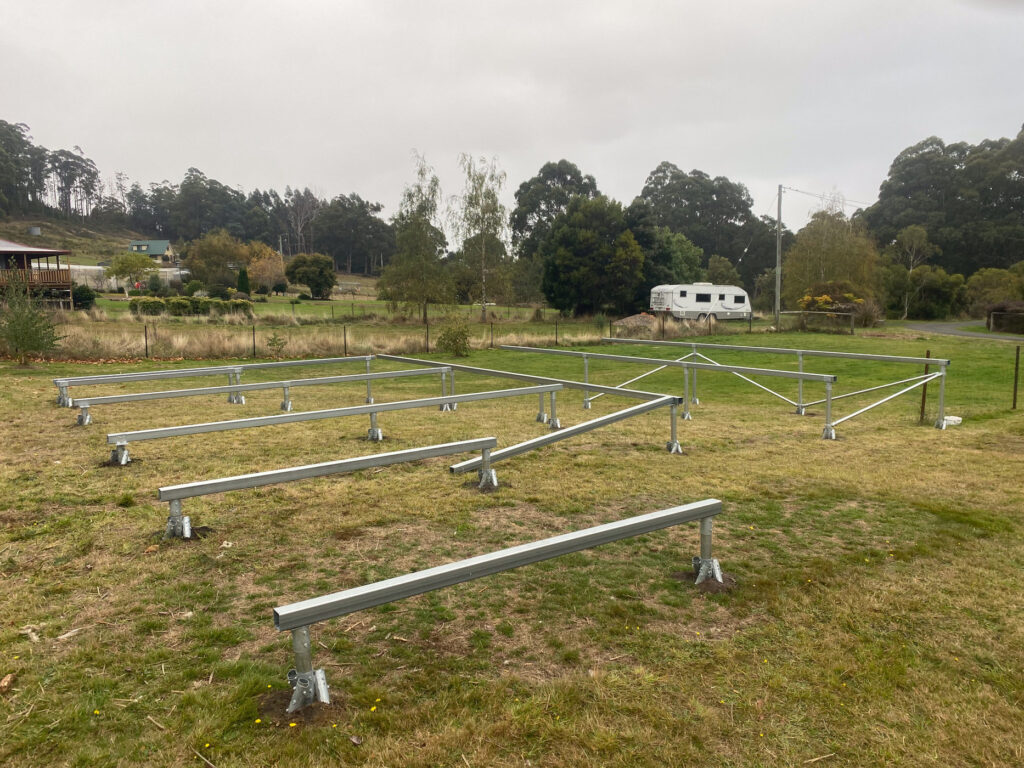 low-disturbance earth anchors with bearers installed